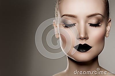 Black lips. Halloween Makeup. Luxury beautiful woman with dark l Stock Photo