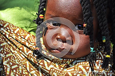 Black little girl with african hair braiding Editorial Stock Photo