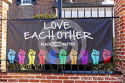 A Black Lives Matter banner attached on the metal fence outside historic Christ Church. Editorial Stock Photo