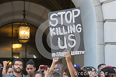 Black lives matter protestors holding a poster during march on C Editorial Stock Photo