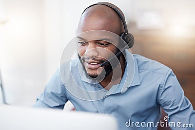Black man, call center worker and CRM with contact us, communication and computer, headset with mic and connect. Male Stock Photo