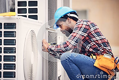 Black man, electrician and maintenance on air conditioner with engineering and handyman working with tools on roof. AC Stock Photo