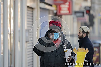 Black Man With Mouth Cap During The Coronavirus Outbreak Eating French Fries At Amsterdam The Netherlands 2020 Editorial Stock Photo