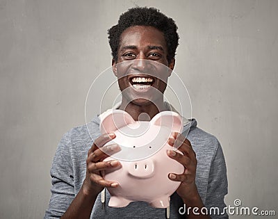 Black man with piggy bank. Stock Photo