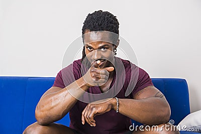 Black man pointing finger to camera with smile Stock Photo