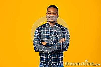 Black Man Posing Crossing Hands Standing In Studio Stock Photo