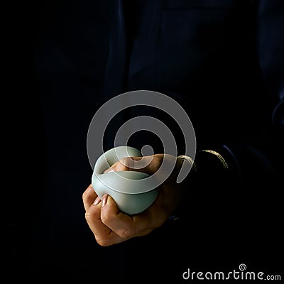 Woman hand isolated on black using anti stress ball Stock Photo