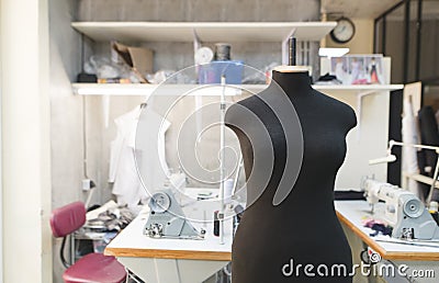 mannequin standing in a sewing studio background jobs. Creation of fashion clothes. Sewing concept Stock Photo