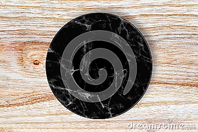 Black marble plate placed on wood. Stock Photo