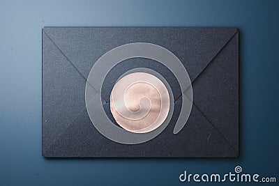 Black matte blank envelope with golden glossy sticker. 3d rendering. Copy space. Empty space. Stock Photo