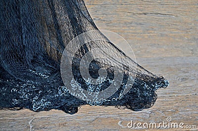 Black mesh with iron chains on old wood floor Stock Photo