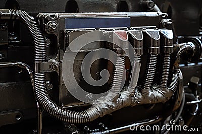 black metal part of a combine or tractor with fuel pipes Stock Photo