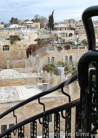 Black metal railing in front of Jerusalem Old City Jewish Quarter buildings and terraces Editorial Stock Photo