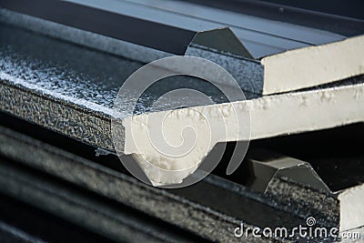 Black metal sheet roof with insulation attached under metal sheet. Stock Photo