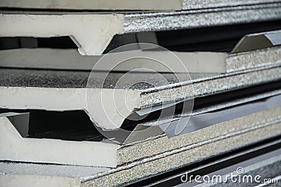 Black metal sheet roof with insulation attached under metal sheet. Stock Photo