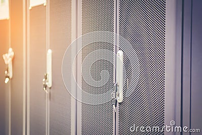 Black metallic door of server rack cabinet. The key is inserted Stock Photo