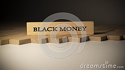 Black money written on wooden surface. finance and politics Stock Photo