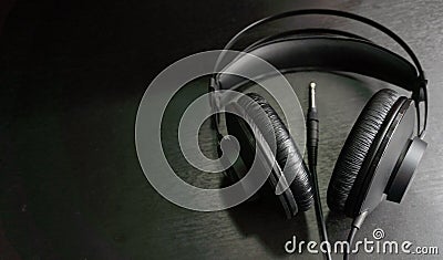 Black music production headphones on black background Stock Photo