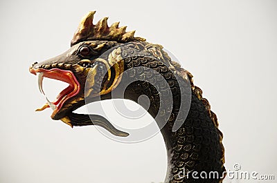 Black naga statue for people take photo at Mae khong riverside Stock Photo