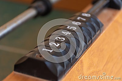 A black number slider on a table of the game of foosball fusbol. Number sequence concept Stock Photo