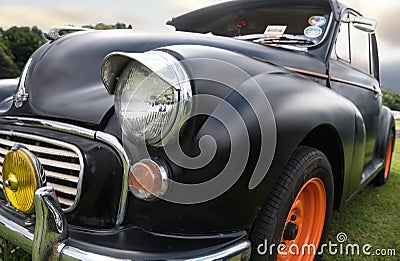 Black and orange front of vintage cars on the grass Editorial Stock Photo