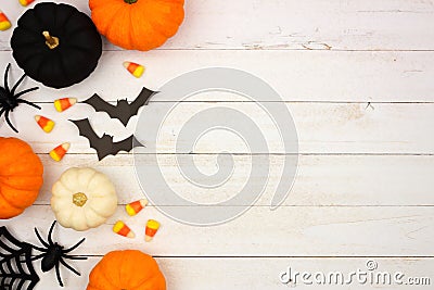 Black, orange and white Halloween side border over white wood Stock Photo