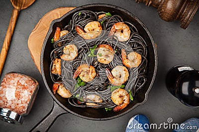 Black pasta with shrimps Stock Photo