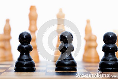 Black pawns lined up Stock Photo