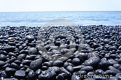 Black pebble beach on the Big Island of Hawaii Stock Photo