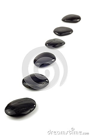 Black pebbles in a row Stock Photo