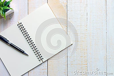 Black pen place on notebook place on white wooden Stock Photo