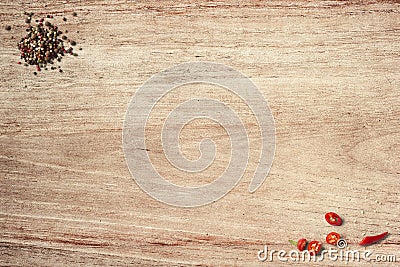 Black pepper and chilly on wooden table top view shot Stock Photo