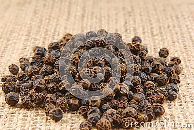 Black pepper on hessian Stock Photo