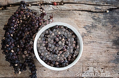 Black pepper on wood table,spices for food. Stock Photo