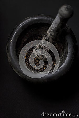 Black peppercorns mortar Stock Photo