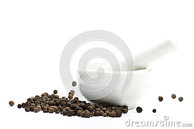 Black peppercorns with mortar Stock Photo