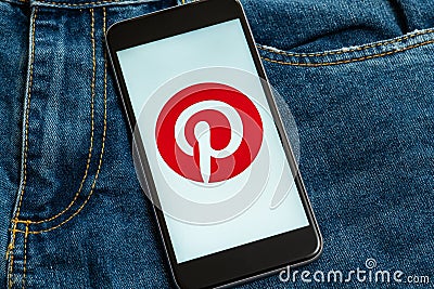 Black phone with red logo of social media Pinterest on the screen Editorial Stock Photo