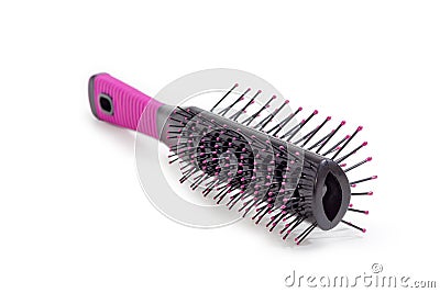 Hairbrush with plastic bristles closeup on a white background Stock Photo