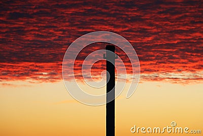 Black pipe in red sky Stock Photo