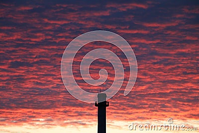 Black pipe in red sky Stock Photo