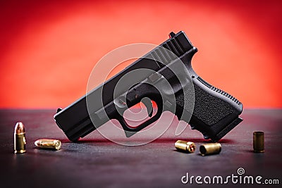 Black pistol on a black table Stock Photo