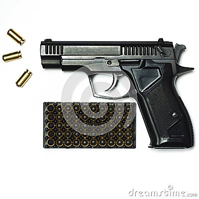 A black pistol with bullets for shooting lie on a white background Stock Photo