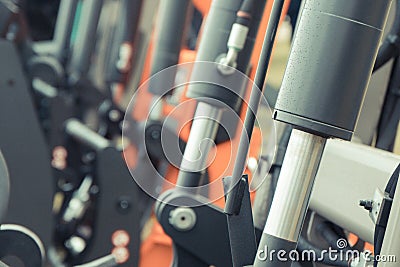 Black pistons or actuators in pneumatic or hydraulic machine. Technology Stock Photo