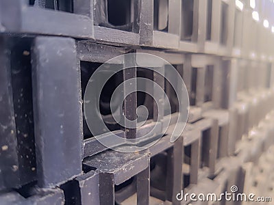 Black plastic mesh compartment for grass planting Stock Photo