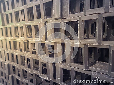 Black plastic mesh compartment for grass planting Stock Photo