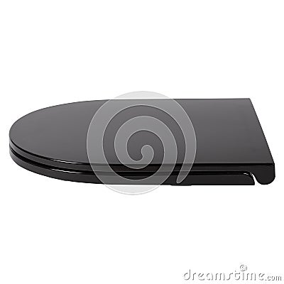 Black plastick modern closed toilet seat lid isolated on white background side view. Stock Photo
