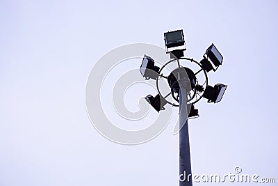 Black Pole light under cloudy sky on the right of photo Stock Photo