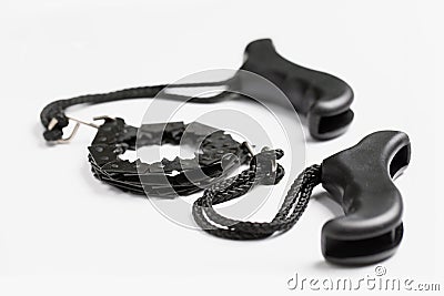 Black portable hand chain saw on white background. Tool for cutting wood and pruning branches. Stock Photo