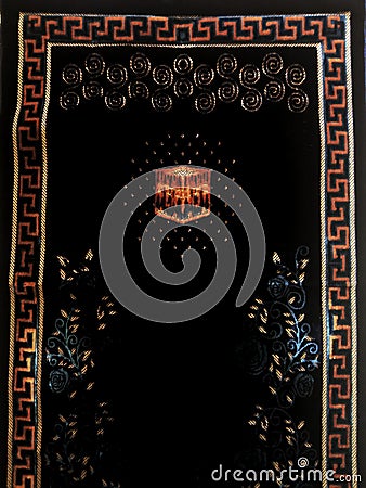 The black prayer rug is a device made of cloth that usually has an Islamic image and style. Prayers are used by Muslims to keep Editorial Stock Photo