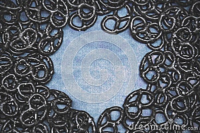 Black pretzel on a dark blue background copy space Stock Photo